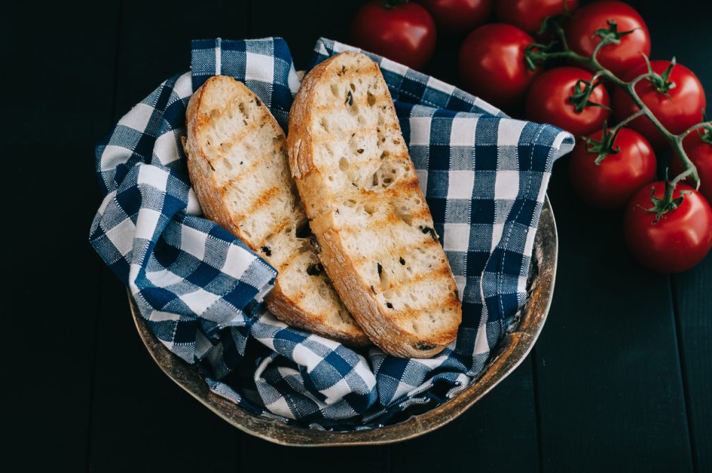 Three slices of toasted bread in silver bread basket