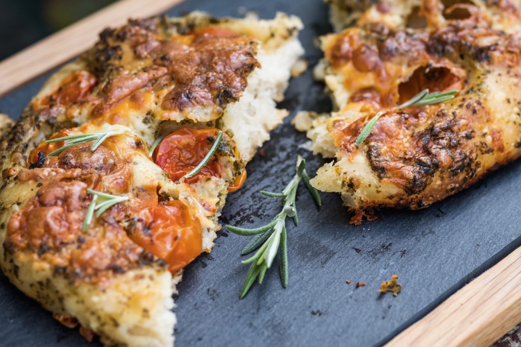 Artisan Focaccia Bread Pizza with Cherry Tomatoes, Pesto, Rosemary Home made pizza