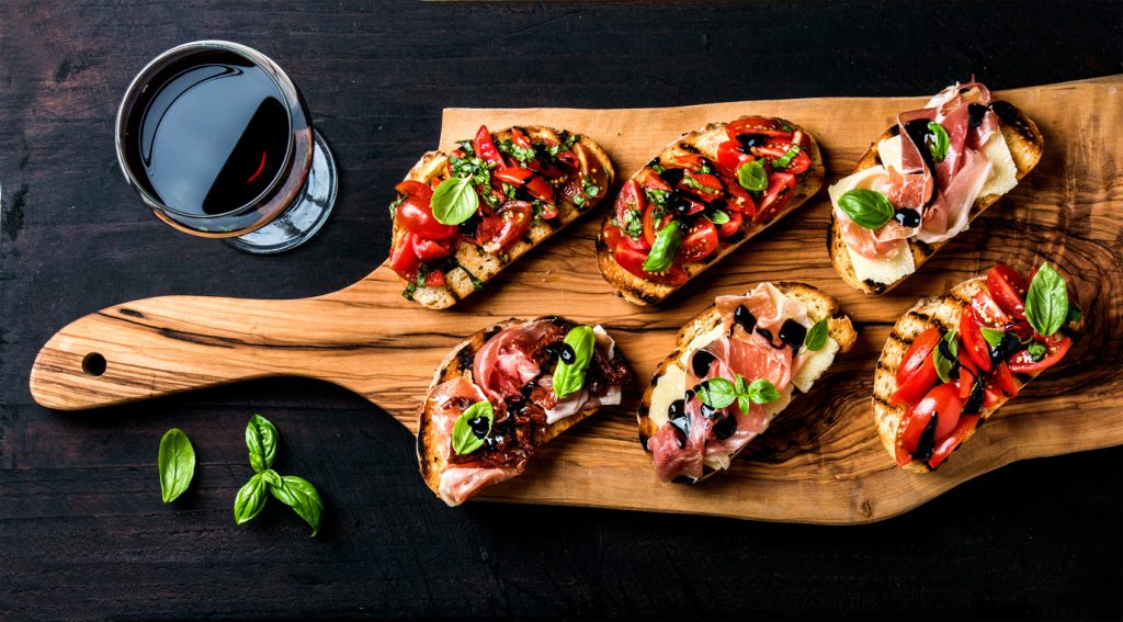 Small open sandwiches with elaborate toppings Lovely slices of brushetta bread