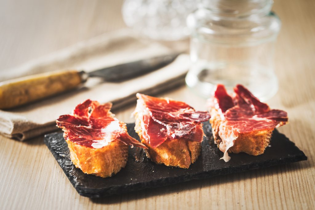 Spanish ham on crispy fresh baguettes Spanish ham tapas, vintage edition.