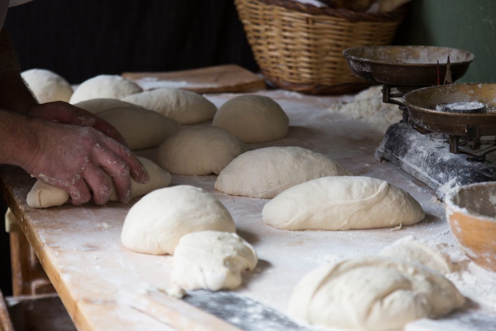 bread preparing for baking in traditional bake house